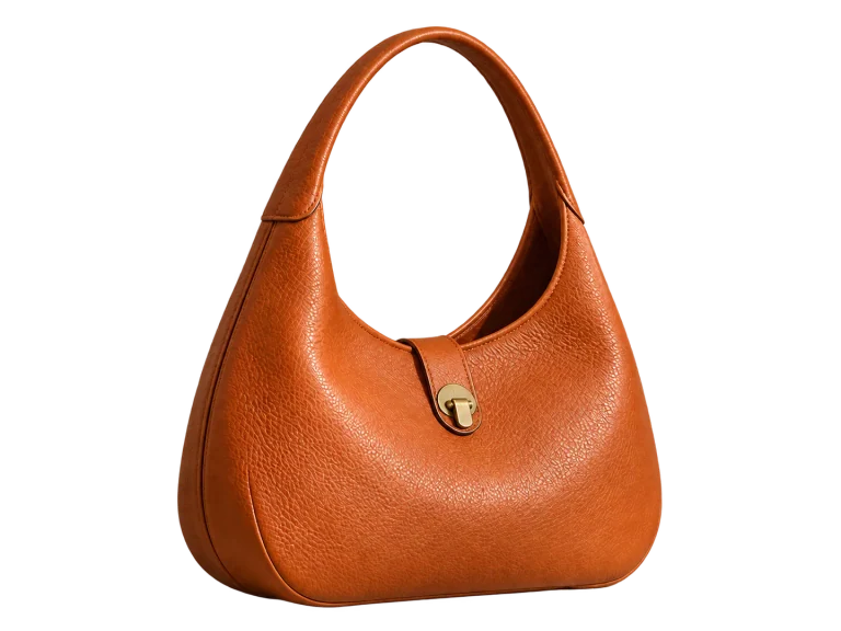 Orange handbag cutout with a transparent opening inside its handle, shown over a checkerboard.