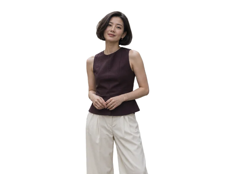 Woman in an aubergine top on a Copenhagen street — White background